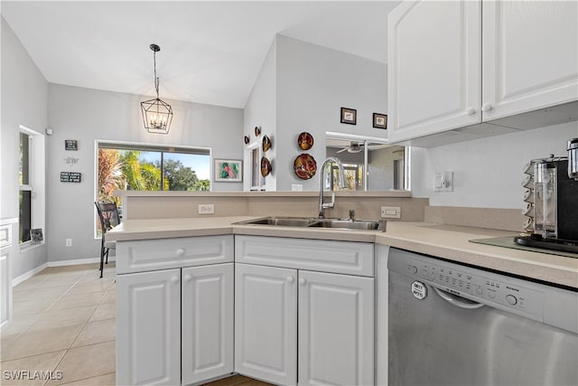 kitchen featuring dishwasher, kitchen peninsula, sink, and white cabinetry