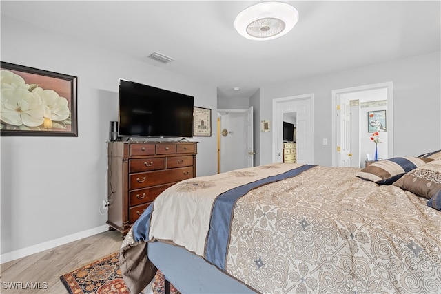 bedroom with light wood-type flooring