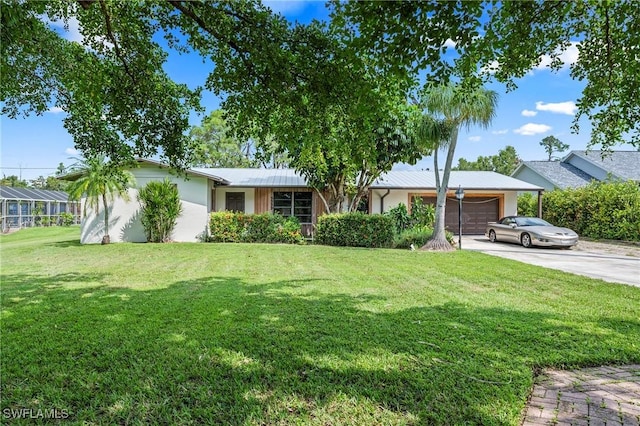 ranch-style house with a garage and a front yard