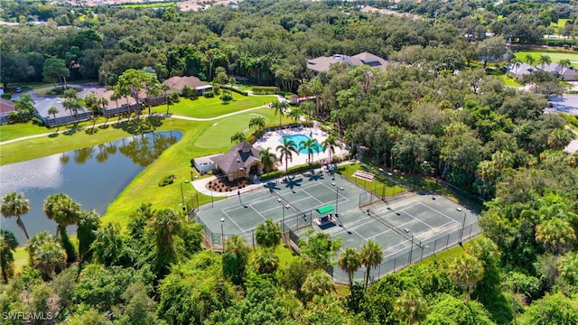 birds eye view of property with a water view