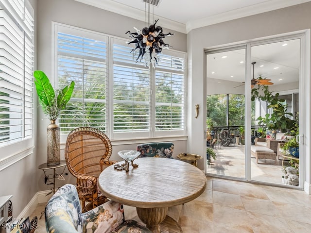 sunroom / solarium with ceiling fan