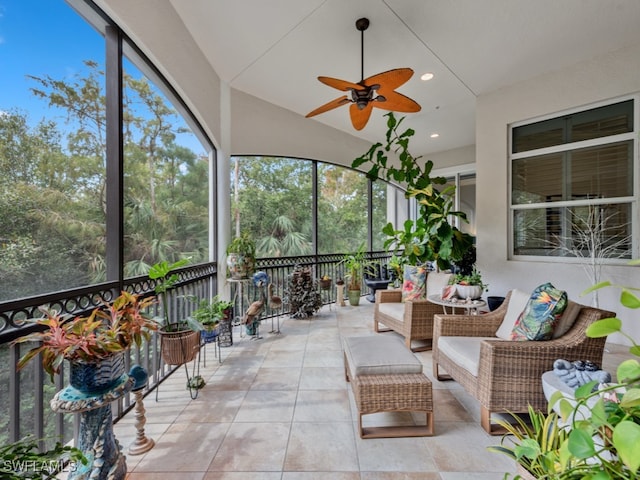 unfurnished sunroom with ceiling fan and vaulted ceiling