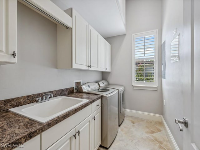 28520 Calabria Ct Unit 201, Naples, FL 34110 - laundry room with baseboards, a sink, light tile patterned flooring, cabinet space, and washer and dryer
