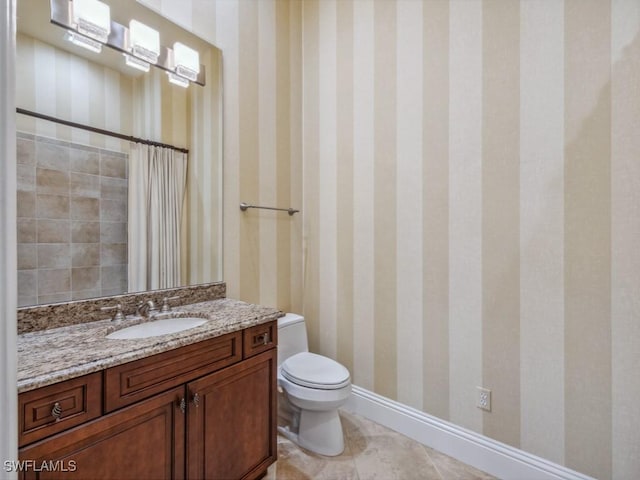 28520 Calabria Ct Unit 201, Naples, FL 34110 - bathroom featuring toilet, vanity, a shower with curtain, baseboards, and wallpapered walls