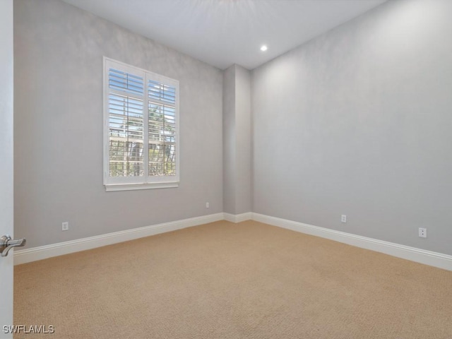 28520 Calabria Ct Unit 201, Naples, FL 34110 - spare room featuring baseboards, light colored carpet, and recessed lighting