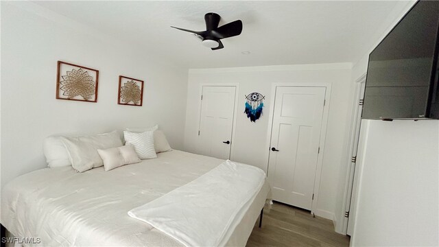 bedroom featuring ceiling fan and light hardwood / wood-style floors