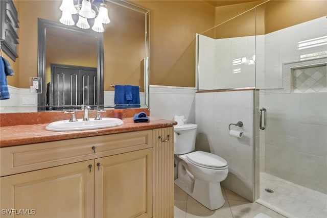 bathroom featuring vanity, tile walls, toilet, and walk in shower