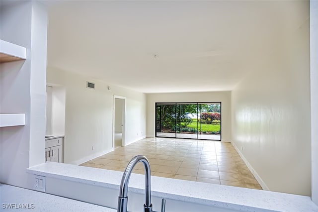 kitchen with light tile patterned floors