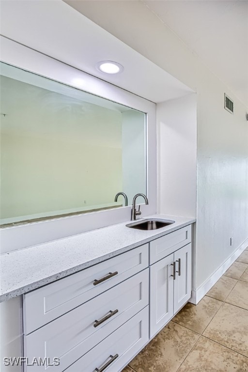 bathroom featuring vanity and tile patterned flooring