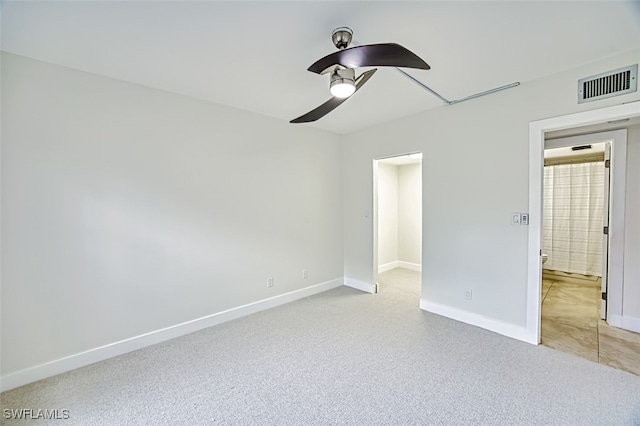 unfurnished bedroom featuring ceiling fan and light colored carpet