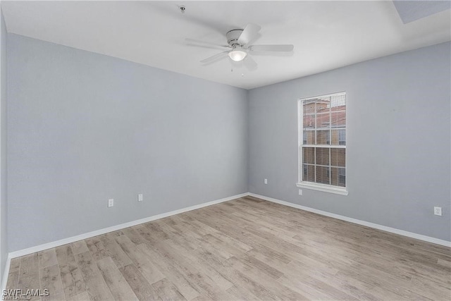 spare room featuring ceiling fan and light hardwood / wood-style floors