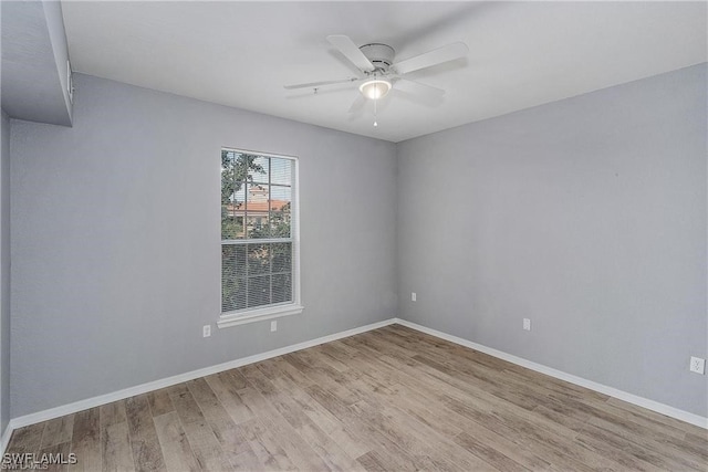 empty room featuring light wood-type flooring and ceiling fan