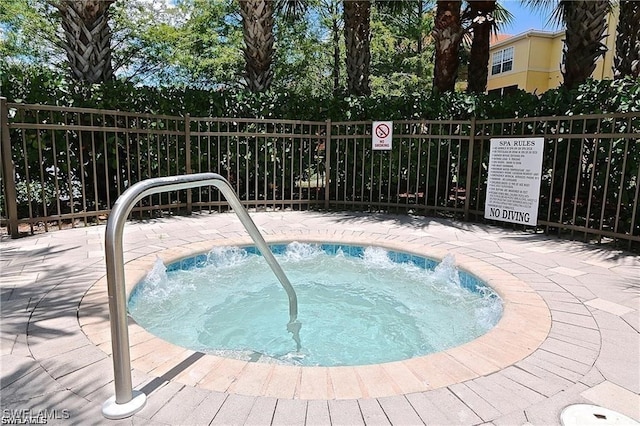 view of pool with a community hot tub