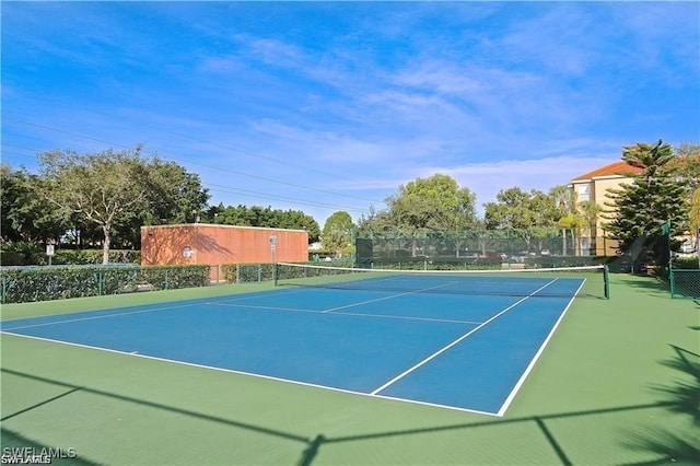 view of sport court with basketball hoop