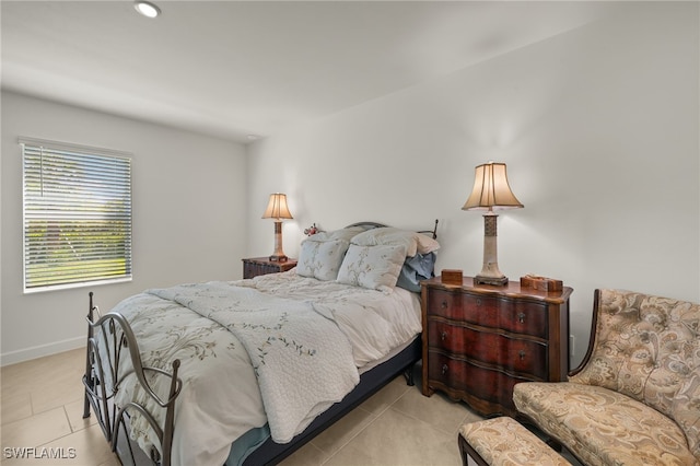 bedroom with light tile patterned floors