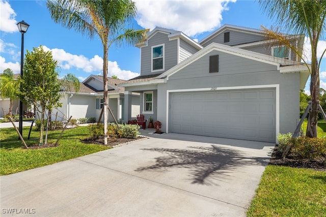 view of front of house featuring a front yard and a garage