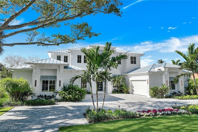 view of front facade with a front yard and a garage