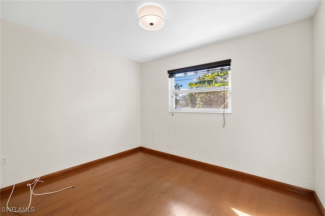 empty room featuring hardwood / wood-style flooring