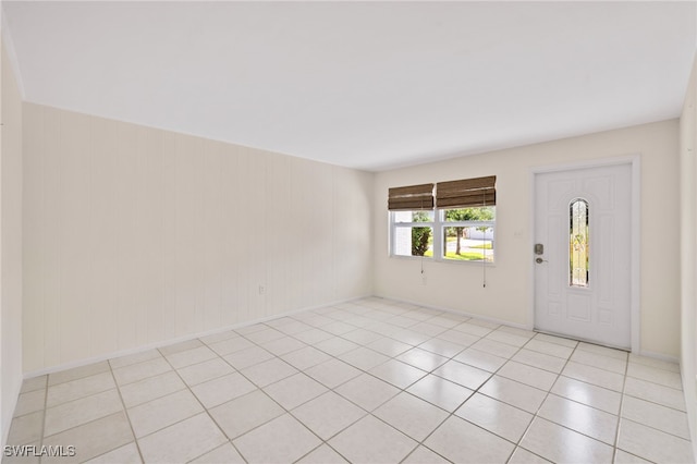 1235 Rordon Ave, Naples, FL 34103 - entryway featuring light tile patterned floors and baseboards