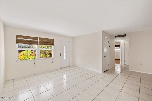 empty room featuring light tile patterned floors