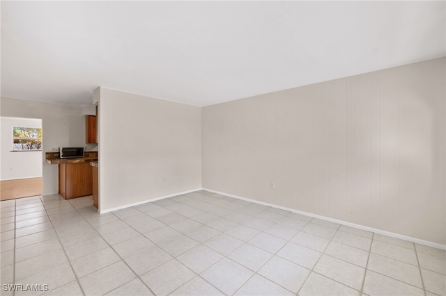 spare room with light tile patterned floors