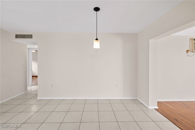 1235 Rordon Ave, Naples, FL 34103 - empty room featuring light tile patterned floors and baseboards