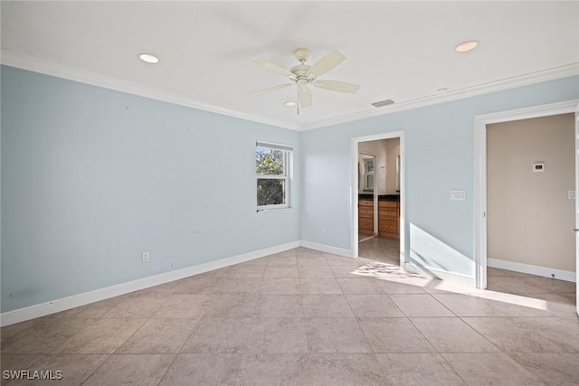 tiled empty room with ceiling fan and ornamental molding