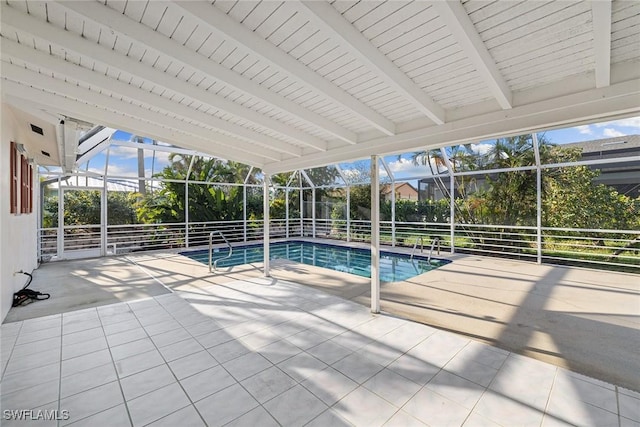 view of pool with a lanai and a patio