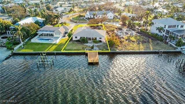 aerial view with a residential view and a water view