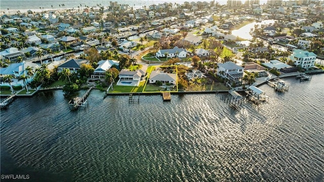 birds eye view of property featuring a residential view and a water view