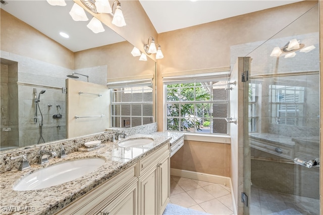 bathroom with tile patterned flooring, lofted ceiling, a shower with shower door, and vanity