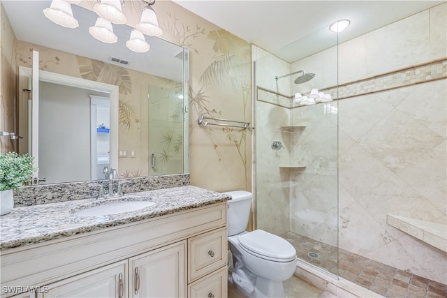 bathroom with walk in shower, vanity, a chandelier, and toilet