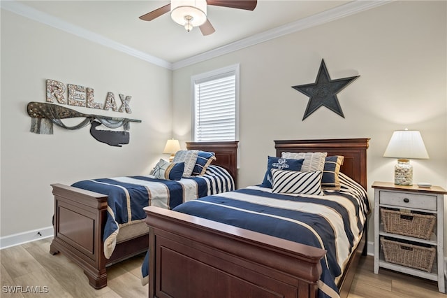 bedroom with ceiling fan, light wood-type flooring, and ornamental molding