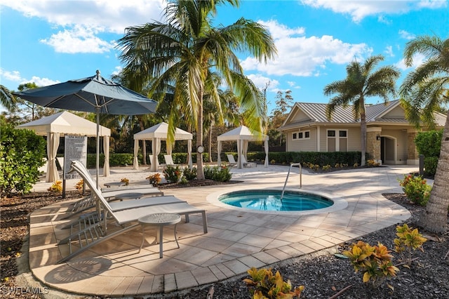 view of pool with a gazebo, a patio area, and a community hot tub