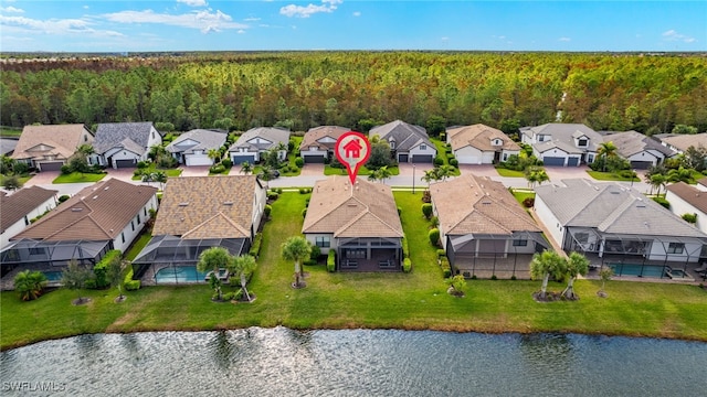 birds eye view of property featuring a water view