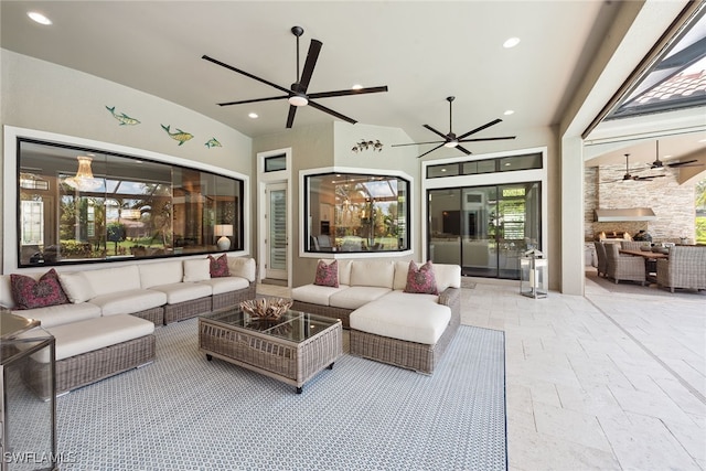 exterior space with an outdoor living space and ceiling fan