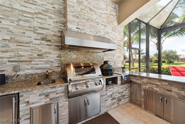 view of patio featuring sink, exterior kitchen, and area for grilling