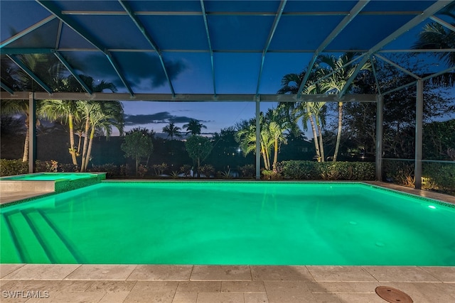 pool at dusk with glass enclosure