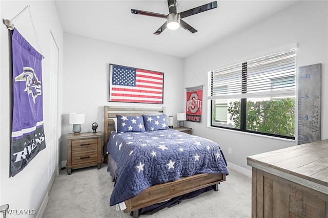 bedroom with light colored carpet and ceiling fan