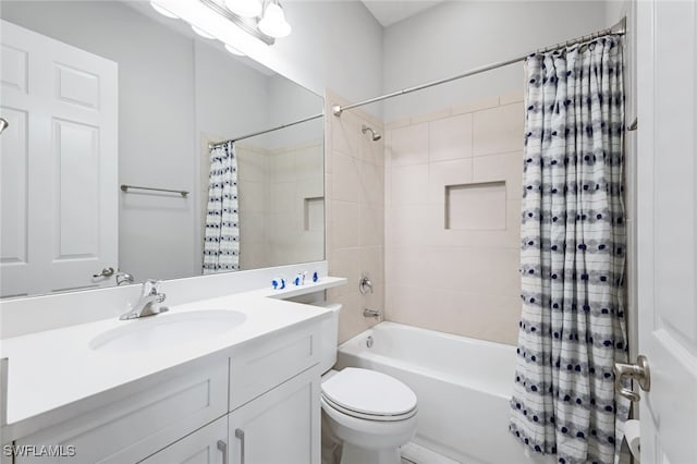 full bath featuring shower / bath combination with curtain, vanity, and toilet