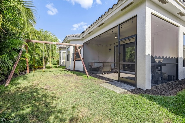 view of yard with a sunroom