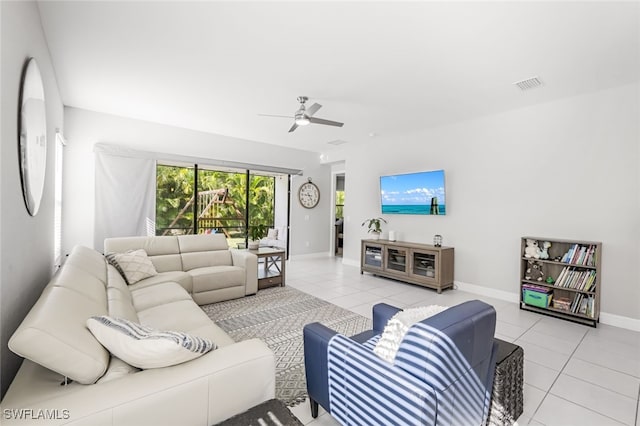 tiled living room featuring ceiling fan