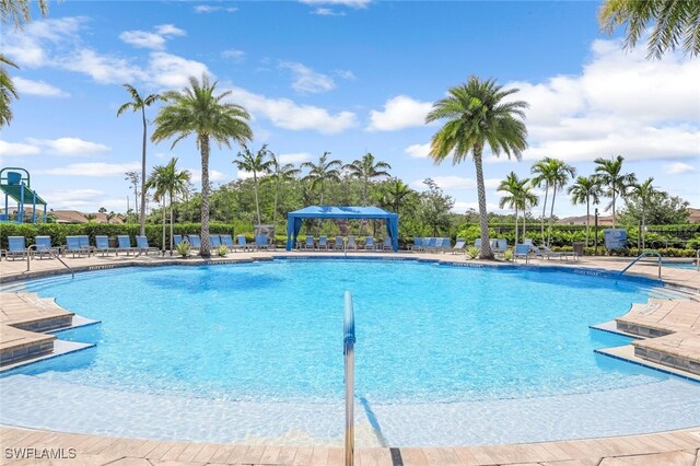 view of swimming pool with a patio area