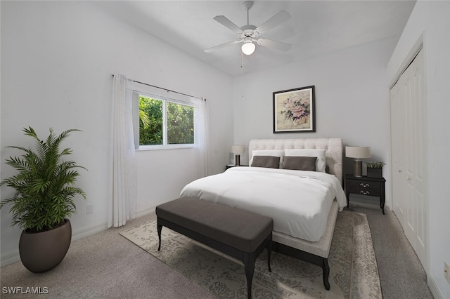 carpeted bedroom featuring ceiling fan and a closet