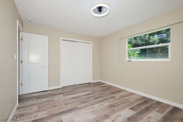 unfurnished bedroom featuring light wood-type flooring