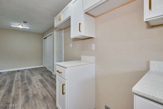 washroom with light hardwood / wood-style floors