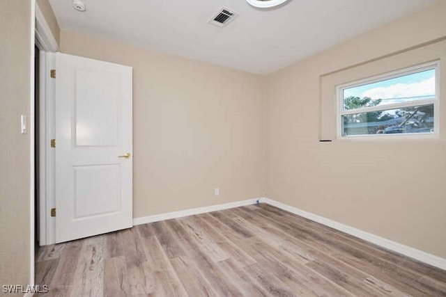 unfurnished room featuring light hardwood / wood-style floors