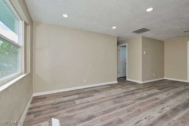 empty room with wood-type flooring