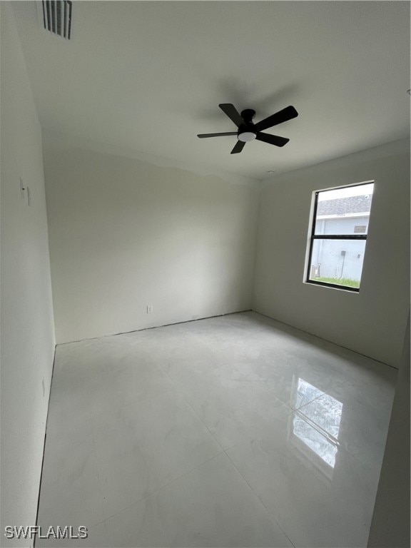 unfurnished room featuring ceiling fan