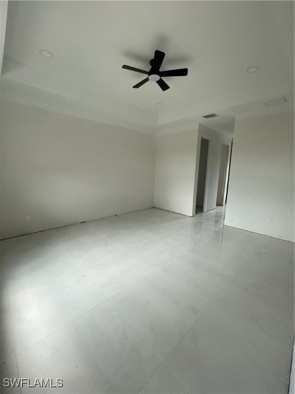 unfurnished room with ceiling fan